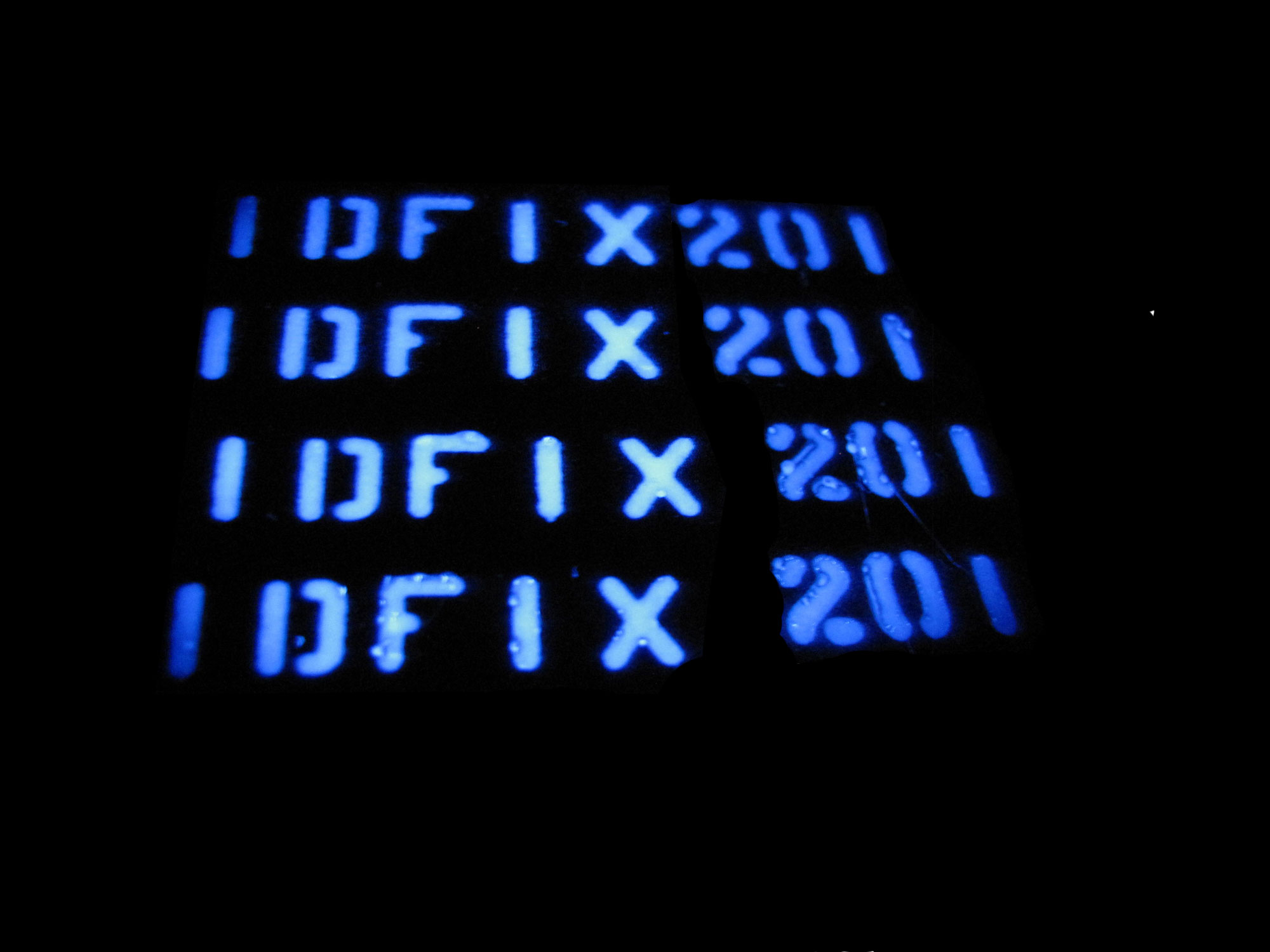 Invisible UV marking on vehicle parts